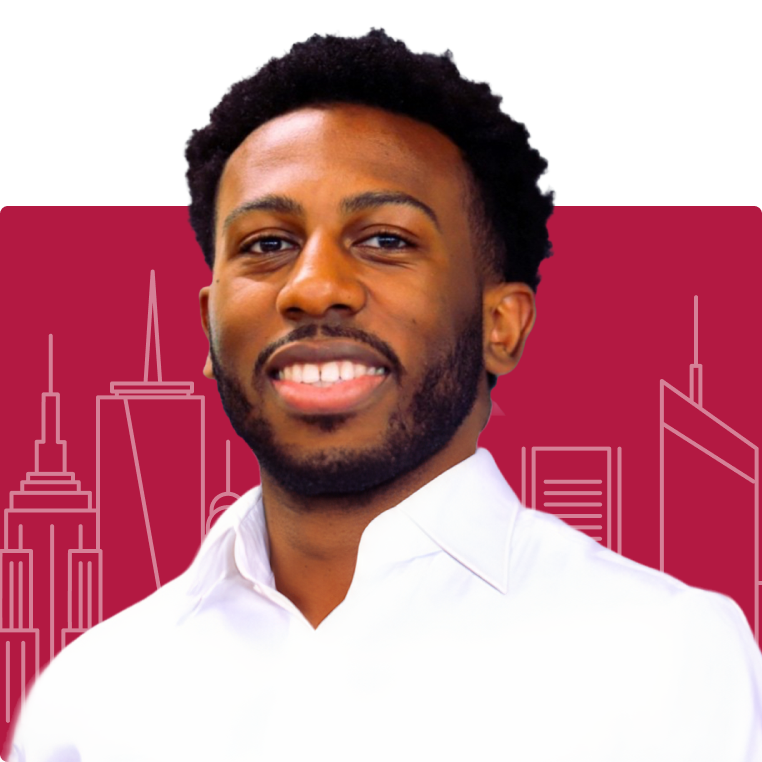 Man smiling in white shirt, urban skyline background.