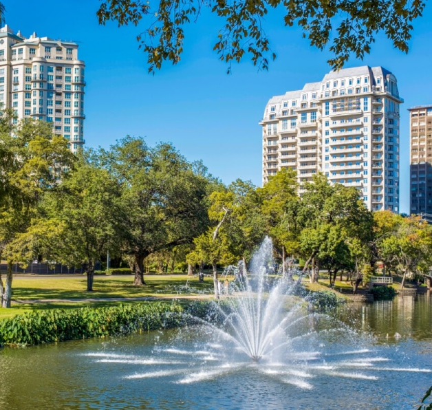 Park fountain with surrounding high-rise buildings