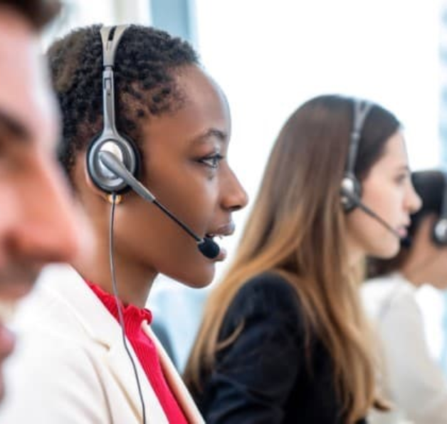 Customer support team wearing headsets.